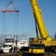 Автокран Liebherr LTM 1200 поднимает катера в яхт-клубе в Москве