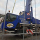 Автокран Liebherr LTM 1050 держит телекамеры на митинге на Красной площади
