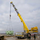 Автокран Liebherr LTM 1500 на разгрузке деталей АЭС в Калининградской области