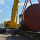 Автокран Liebherr LTM 1500 на погрузке деталей АЭС в Южном речном порту в Москве
