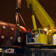 Автокран Liebherr LTM 1500 на погрузке деталей АЭС в Южном речном порту в Москве