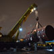 Автокран Liebherr LTM 1500 на погрузке деталей АЭС в Южном речном порту в Москве