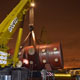 Автокран Liebherr LTM 1500 на погрузке деталей АЭС в Южном речном порту в Москве